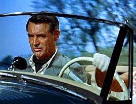 Cary Grant in Ascot Knot as fashionable alternative of the formal necktie, with Grace Kelly driving the car