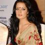 Celina Jaitley in saree in layered hairstyle with curls and fringes